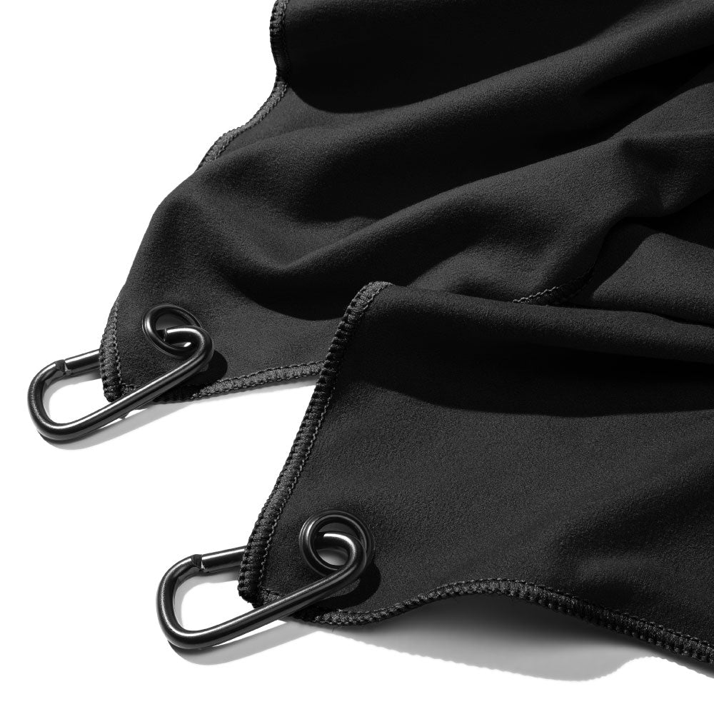 Black fabric with metal carabiners on a white background, a DRYKI Pocket-sized sweat towel (sweat absorbing handkerchief)